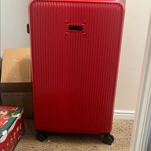 Textured Red roller Suitcase